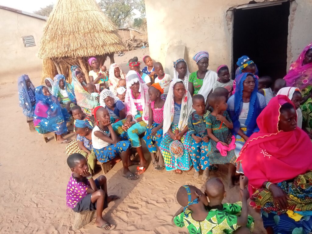 Evangelism outreach by MIAP International team in Teokpara, Parakou — community members hearing the Gospel and receiving hope in Christ.